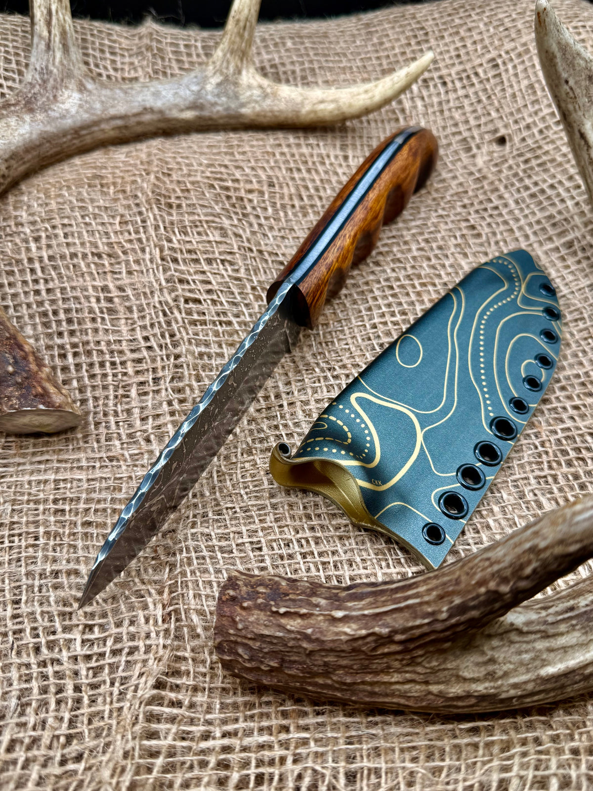 The Stormbreaker spine and desert ironwood handle with black G10 liners