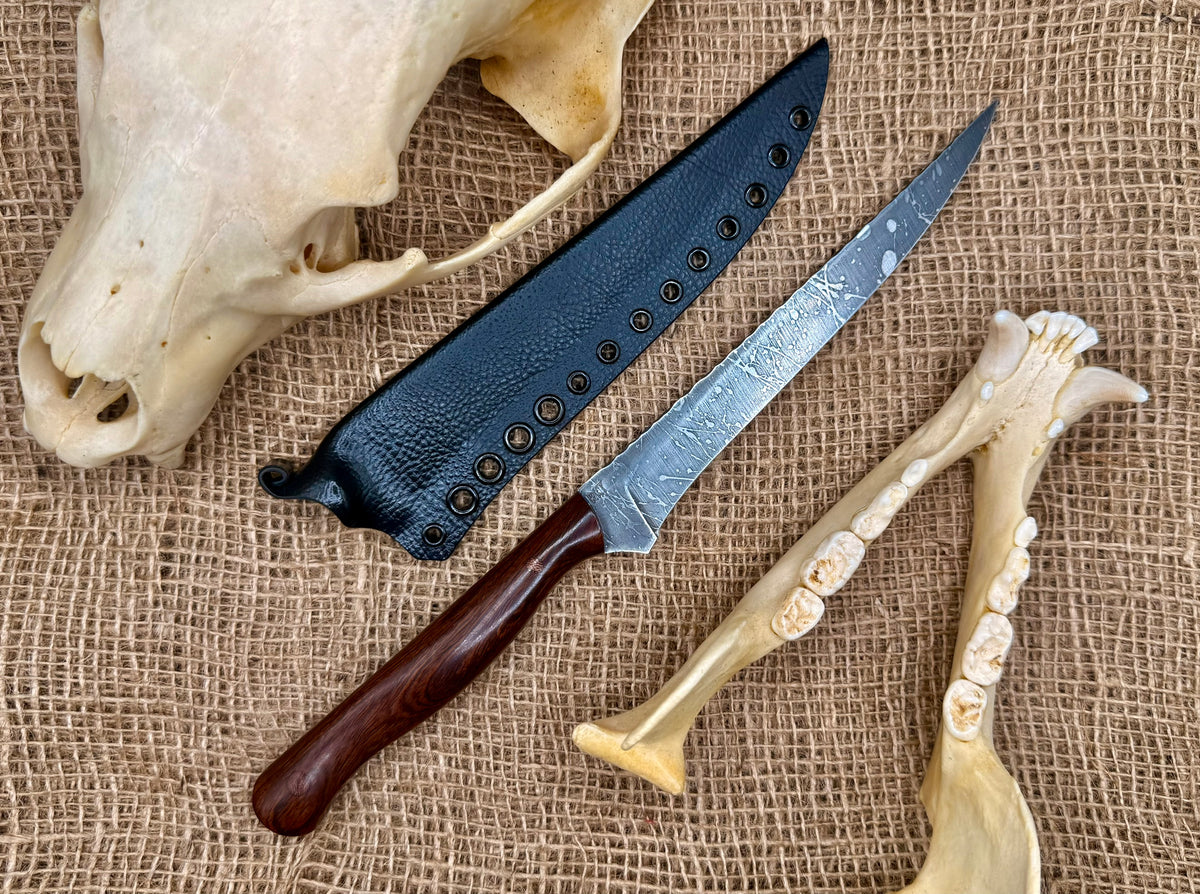 The Reef 7" fillet knife and kydex sheath on burlap