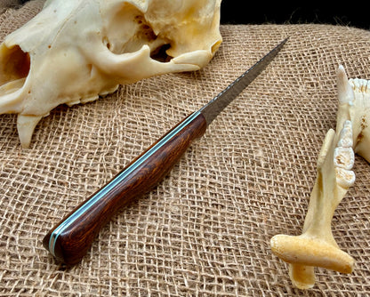The Reef desert ironwood handle with teal blue G10 liners